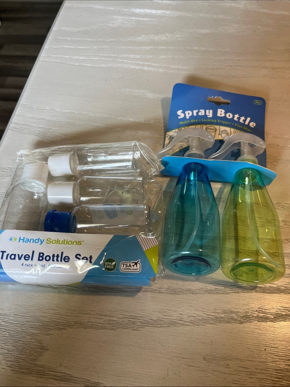 Travel Bottle Set with Blue and Green Spray Bottles